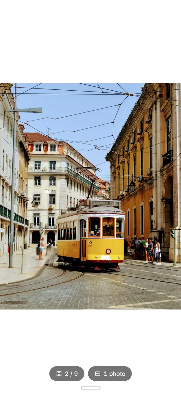The same book in the phone reader: a yellow Lisbon tram filling the page, with a page counter at the bottom.